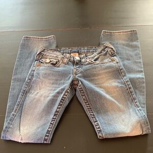 True Religion low rise, straight leg lightly distressed jeans.